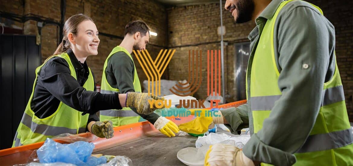 a group of people in a factory sorting recycling