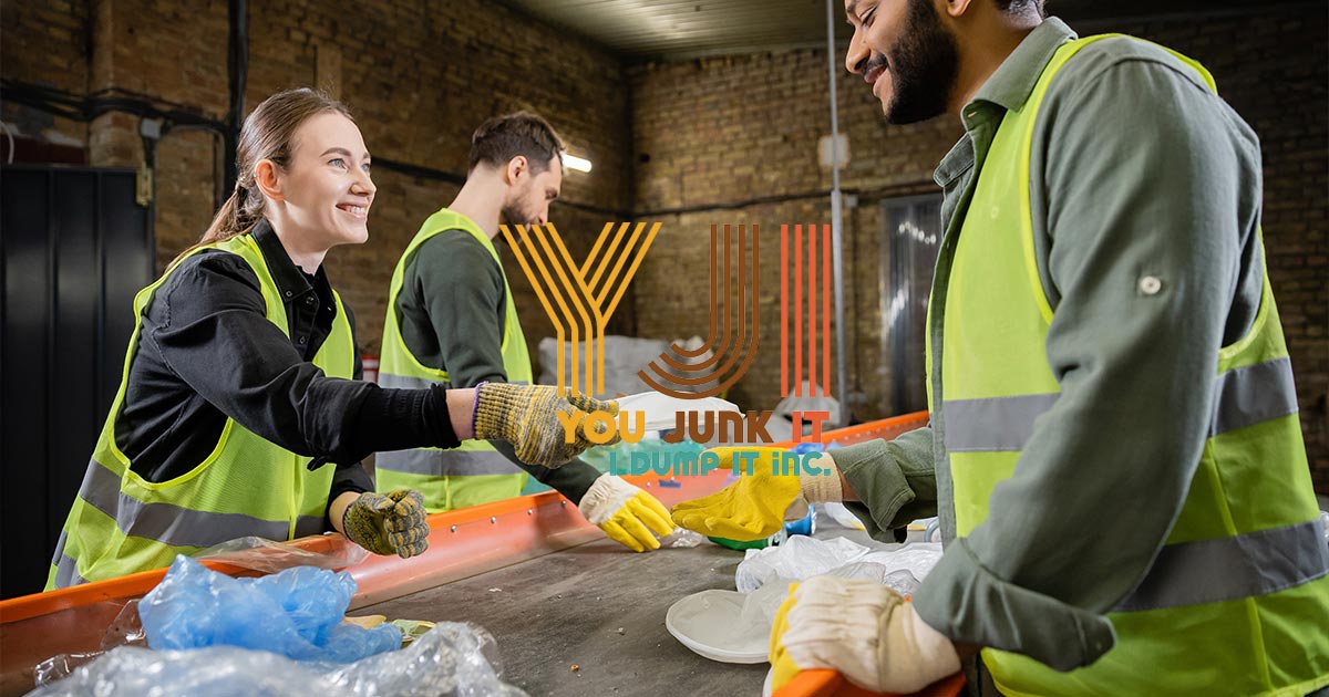 a group of people in a factory sorting recycling