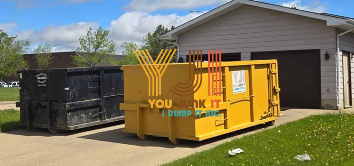 yellow junk bin sitting on the driveway of an edmonton home