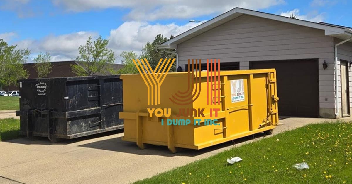 yellow junk bin sitting on the driveway of an edmonton home