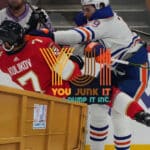 oilers player hitting florida player into a junk bin