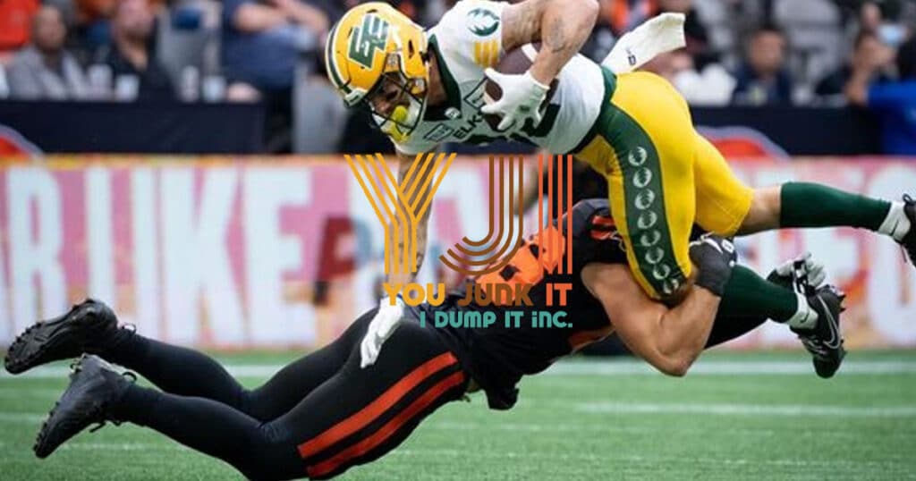 Helmeted football player tackling opponent during game, logo overlay, sports action scene.