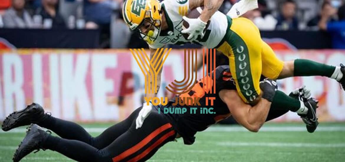 Helmeted football player tackling opponent during game, logo overlay, sports action scene.