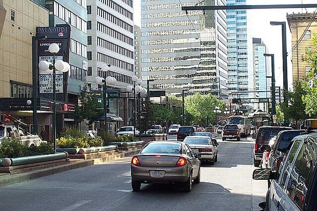 TRAFFIC ON CITY STREET WITH HIGH-RISE BUILDINGS, urban debris removal services, junk hauling, and eco-friendly disposal solutions by You Junk It.