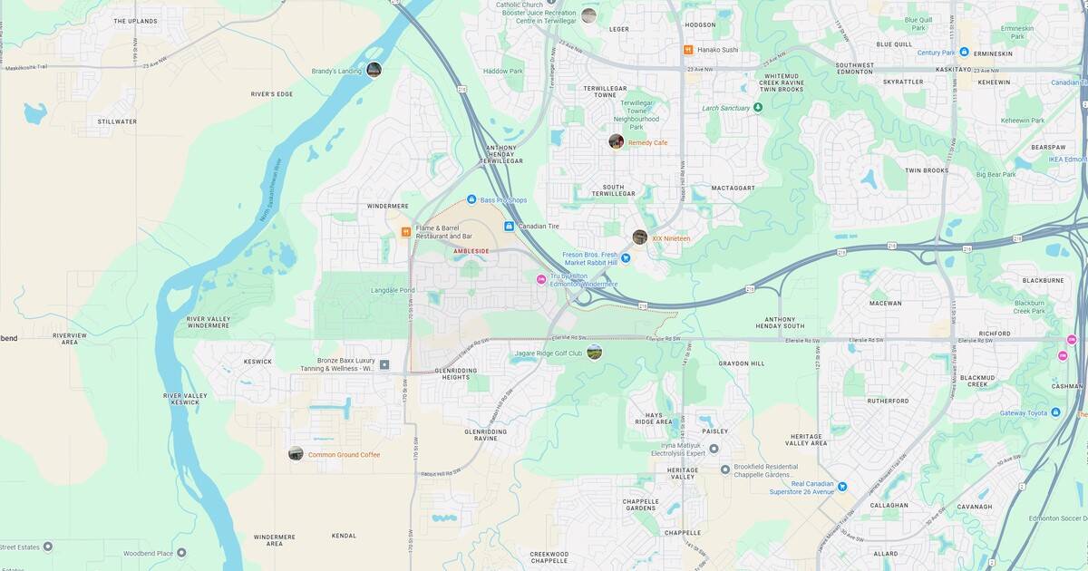 Brandy's Landing on the river with lush green surroundings and park nearby, offering scenic views and outdoor activities in Terwillegar neighborhood.