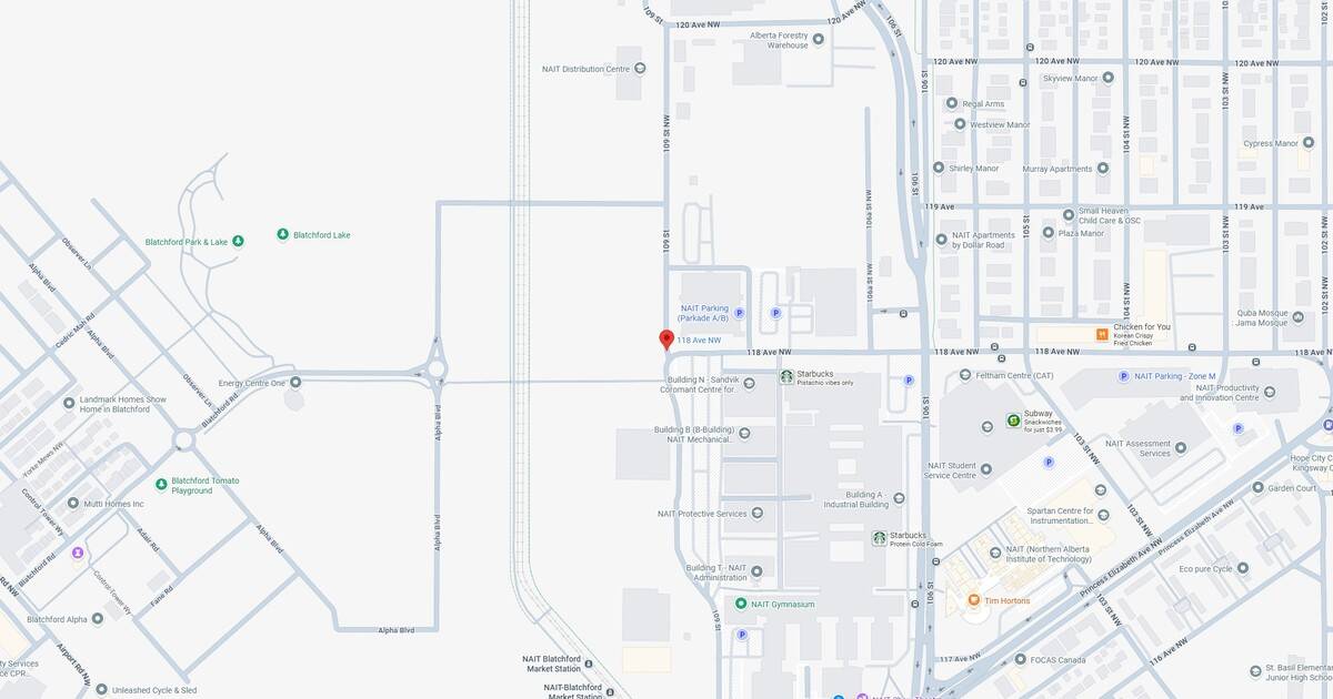 Detailed view of NAIT (Northern Alberta Institute of Technology) showing buildings, parking lots, and nearby landmarks.