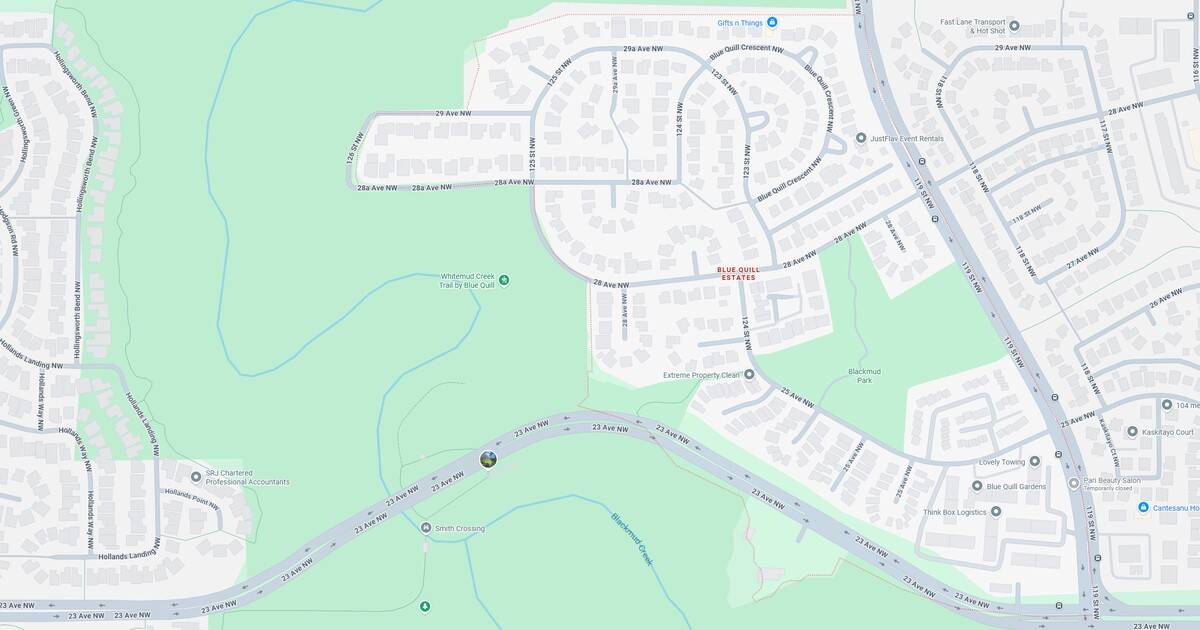 Map of a suburban neighborhood showing streets, green spaces, and a nearby highway, highlighting residential areas and natural surroundings.