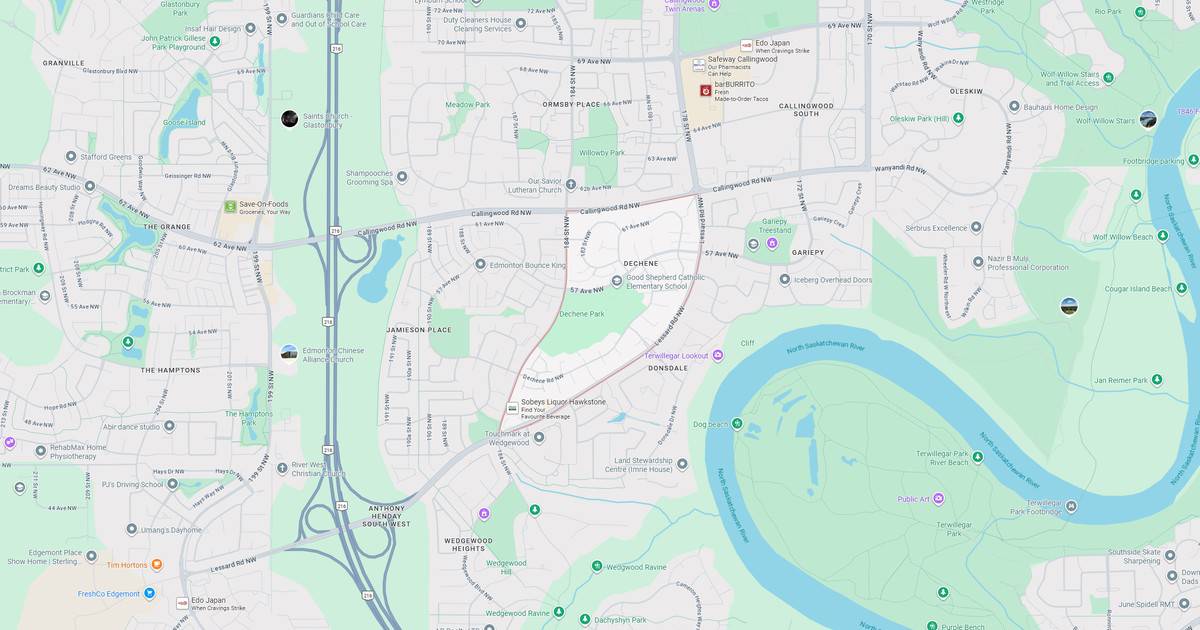 A detailed map of a city park featuring a large river, surrounding green areas, roads, and pathways for visitors.