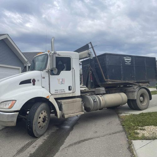 You Junk It Truck Dropping off Bin in Rosenthal Edmonton